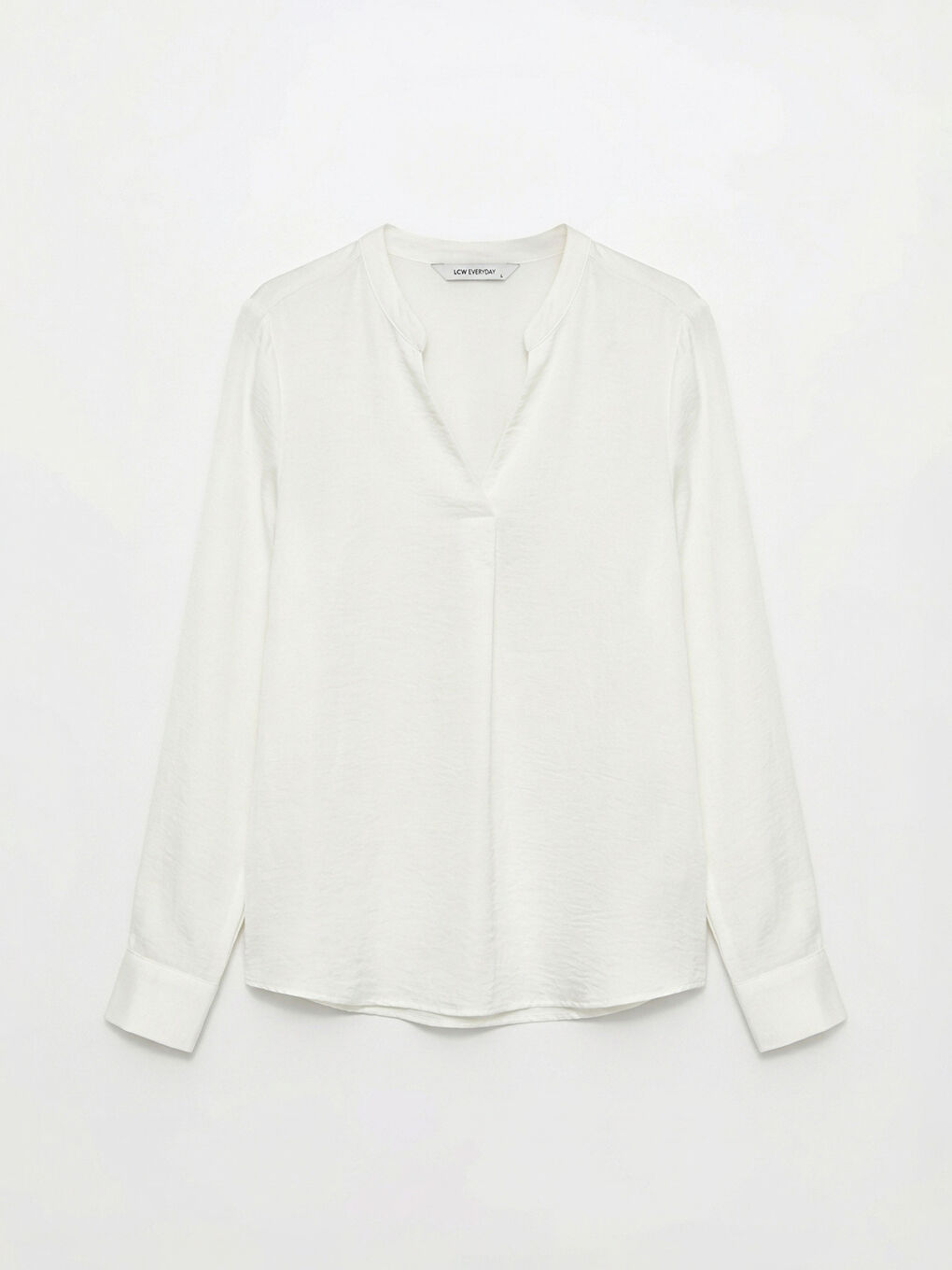 Textured blouse with an asymmetrical neckline.-4