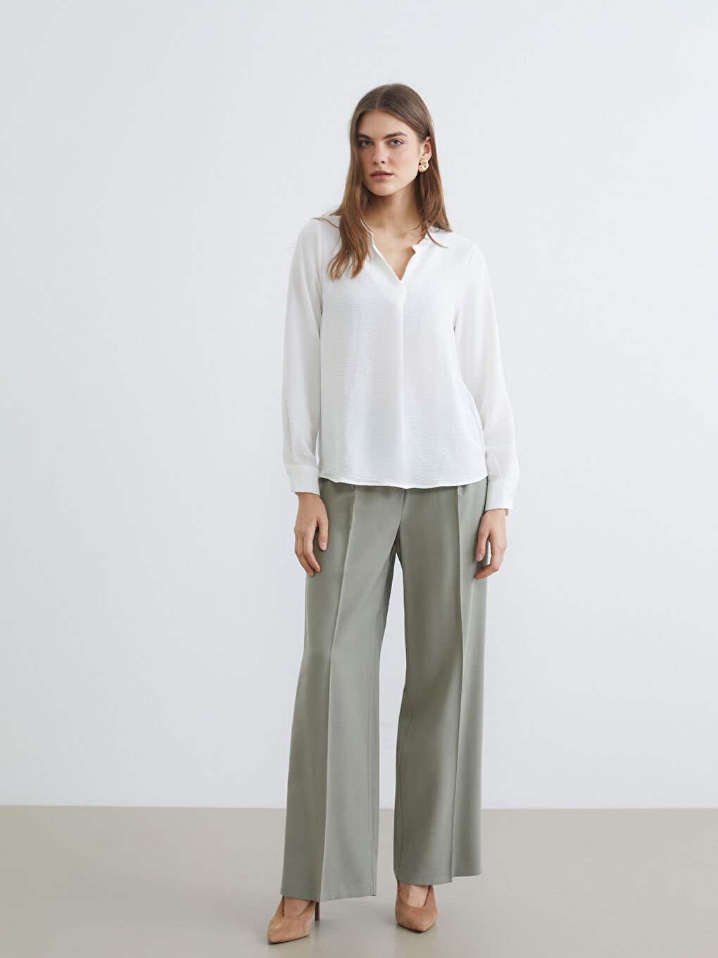 Textured blouse with an asymmetrical neckline.-1