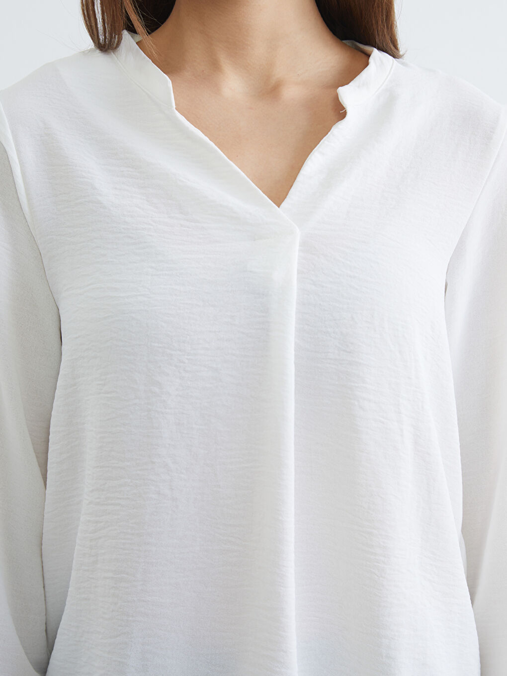 Textured blouse with an asymmetrical neckline.-2