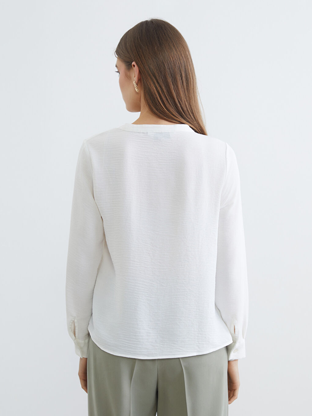 Textured blouse with an asymmetrical neckline.-3