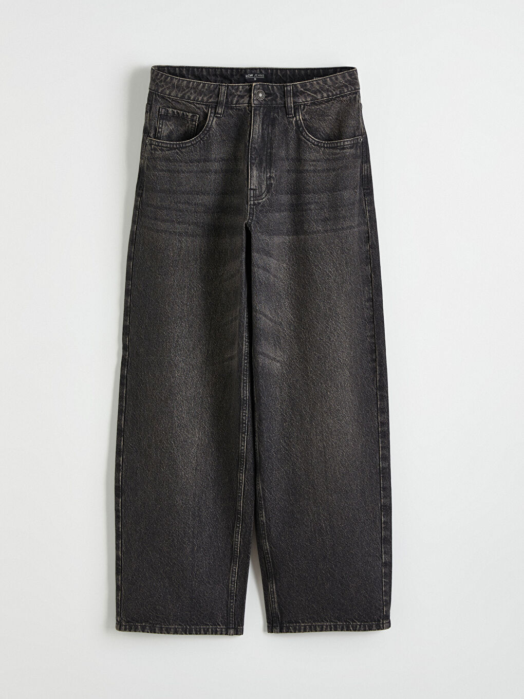 ქალი რუხი ჯინსი