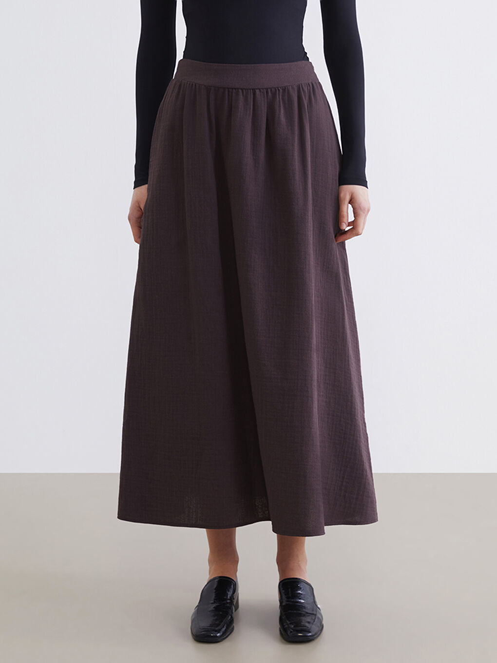 تەنورە قاوه‌یی ژن-1