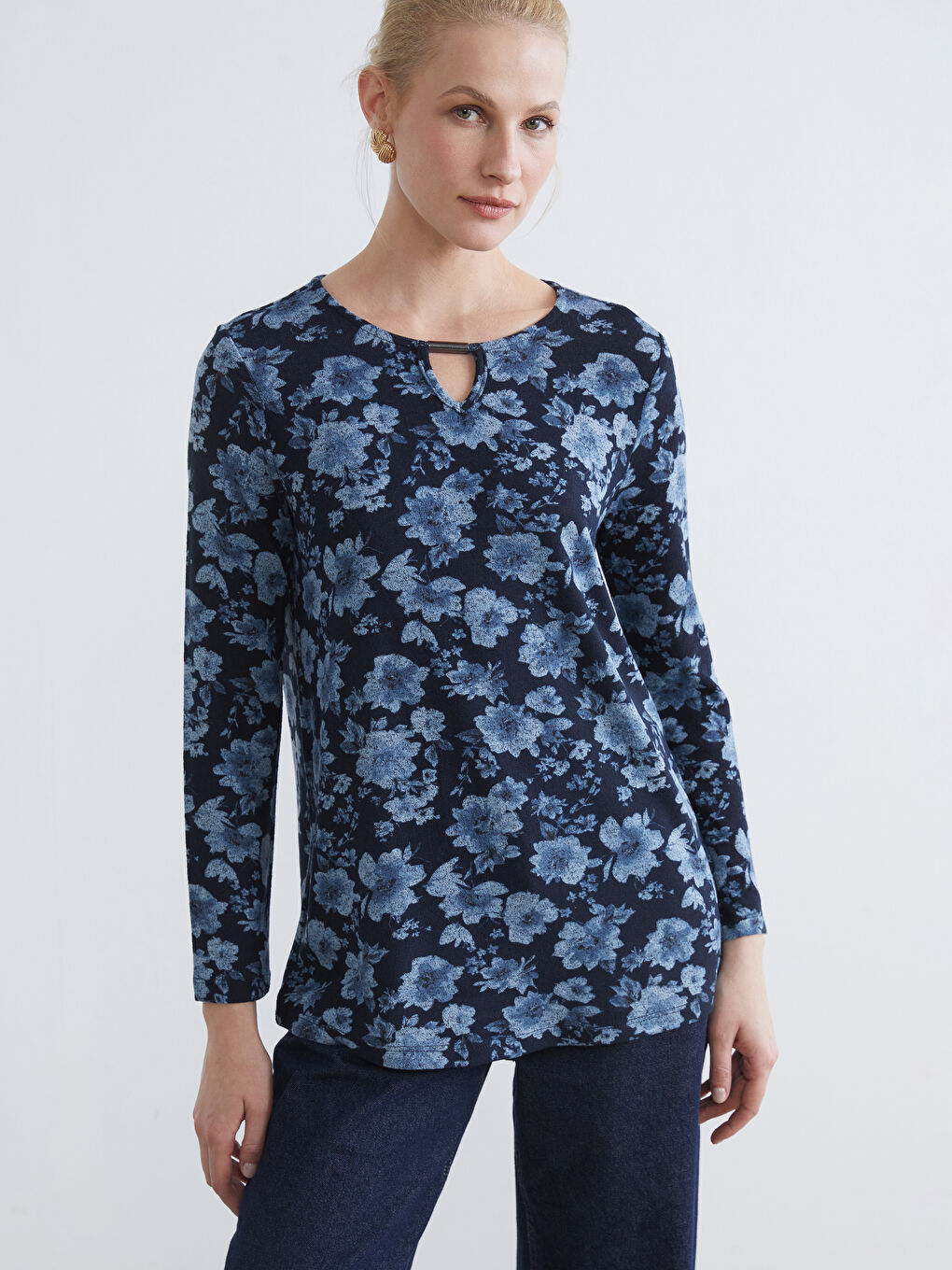 Floral blouse with a crew neck.
