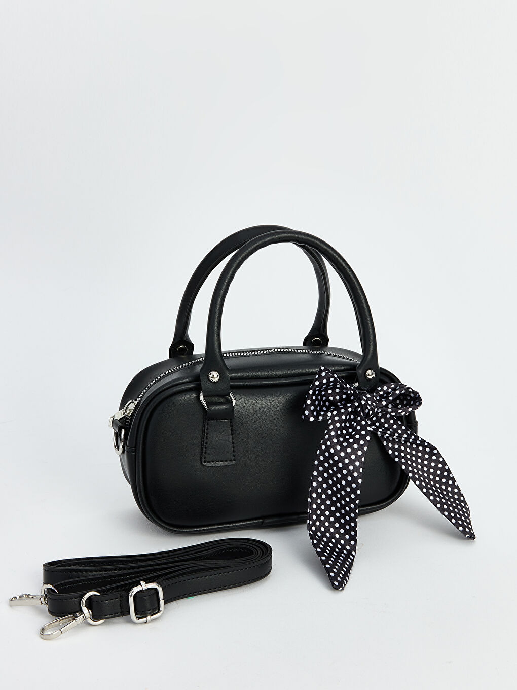 Girls' shoulder bag with scarf detail.