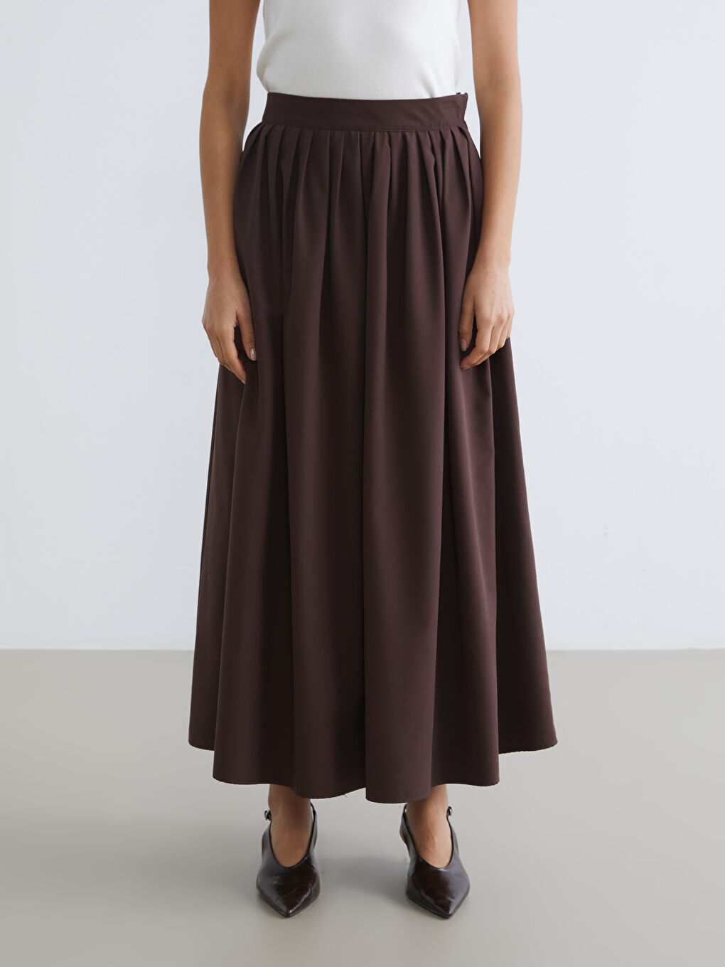 تەنورە قاوه‌یی ژن-1