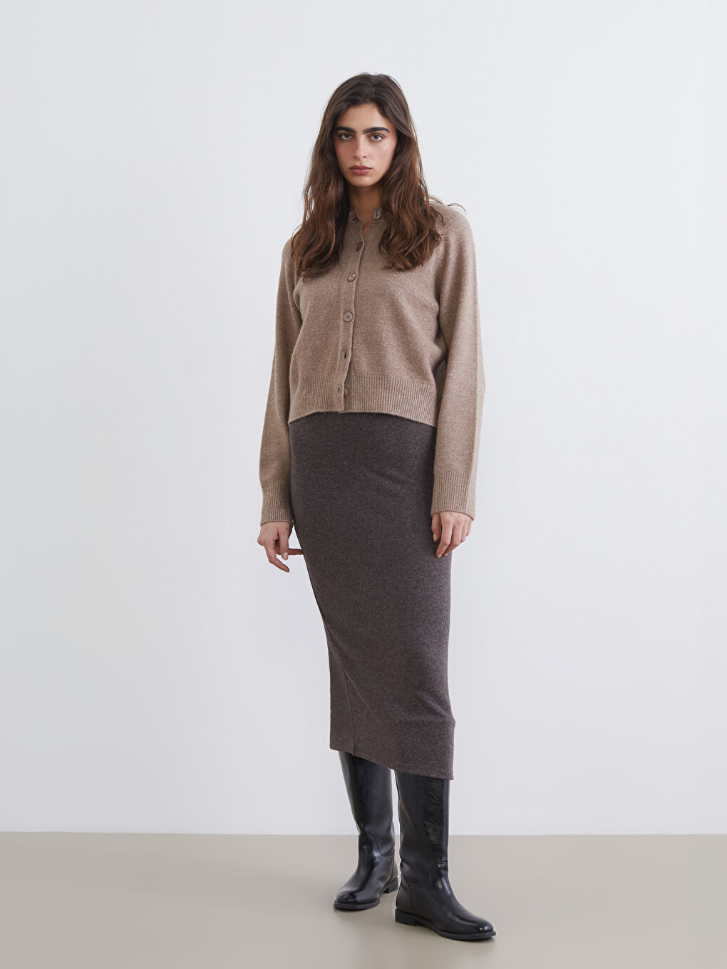 Ribbed knit skirt with elastic waist and slit.
