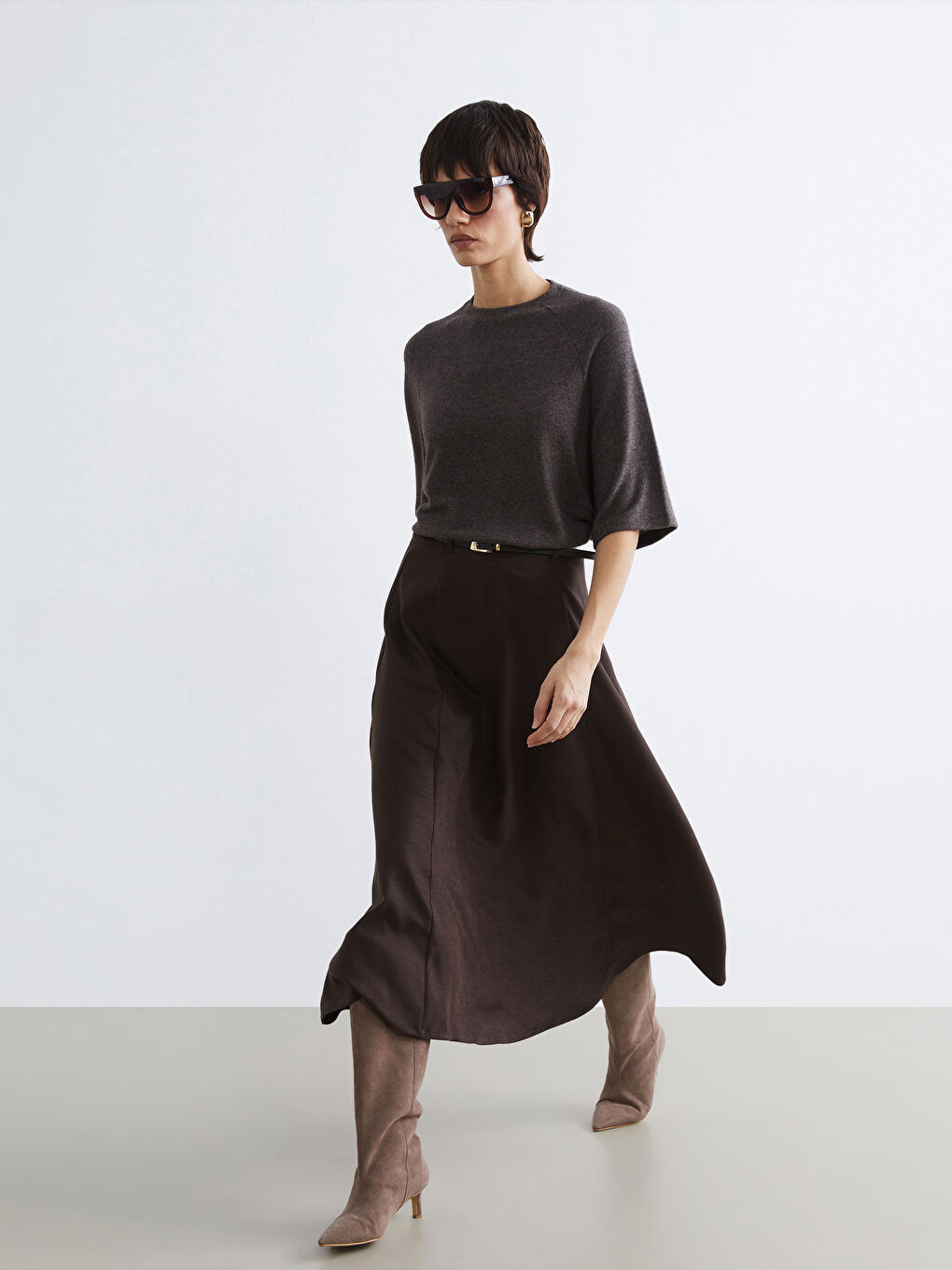 A-line, faux-suede skirt with a belted waist.