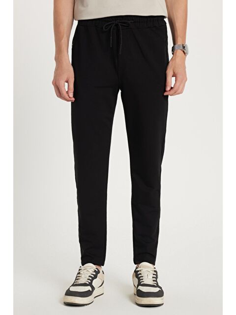 TUDORS Unisex Standart Fit Pamuklu 2 İplik Fermuar Cepli Lastikli Bağlamalı Düz Paça Siyah Eşofman Altı - S000518911-19351