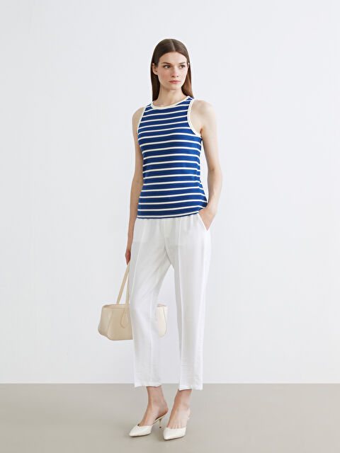 LCW Modest Effortless elegance meets everyday comfort in our carrot-cut trousers, designed with a flattering elasticated waist. - S65116Z8-QVD