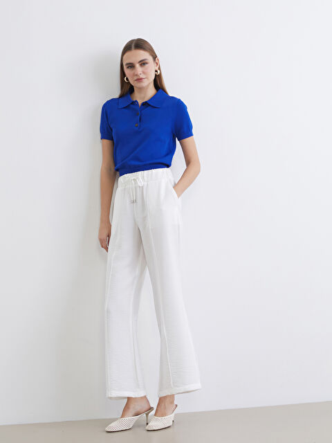 LCWAIKIKI Classic Effortless elegance meets everyday comfort in our wide-leg trousers with a flattering elasticated waist. - S6AP10Z8-FDU