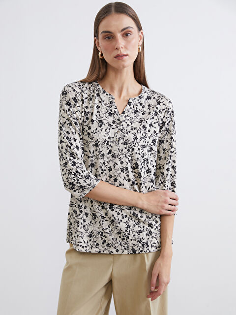 LCW Grace Floral blouse with an asymmetrical neckline. - S6CV09Z8-SWC