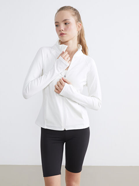 KOOR SPORT High-neck, zippered women's sweatshirt with thumbholes.