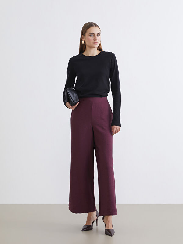LCWAIKIKI Classic L’élégance sans effort rencontre le confort quotidien dans notre pantalon à jambes larges avec une taille flexible.