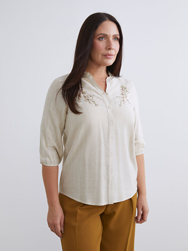 LCW Grace Striped linen-blend blouse with a unique neckline.