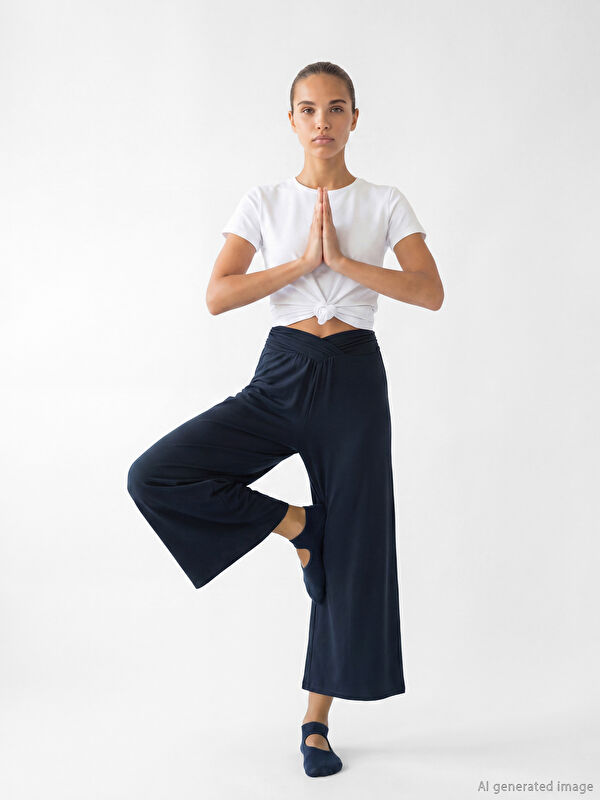 KOOR SPORT پانتۆڵی ئارەقەی ژنانه‌ بە کەمەری لاستیکی نەرمی دەستپێک