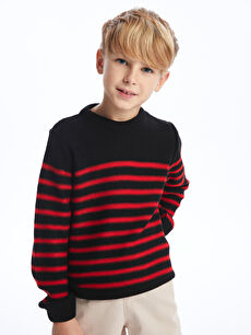 Black sweater with store red striped sleeves